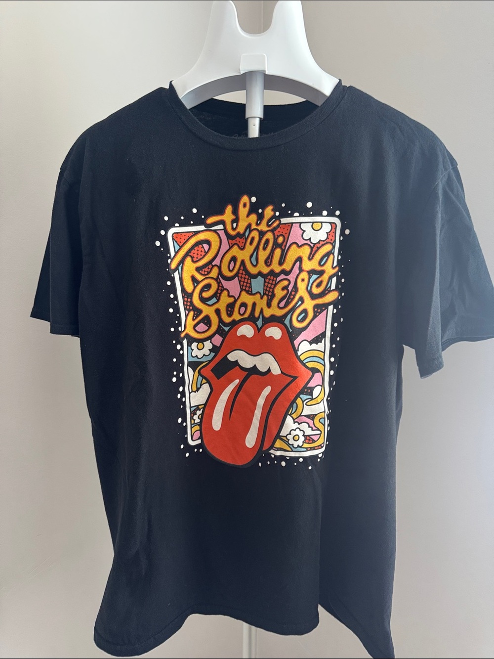 the Rolling Stones Black Graphic Tee with Red Tongue and Yellow Script